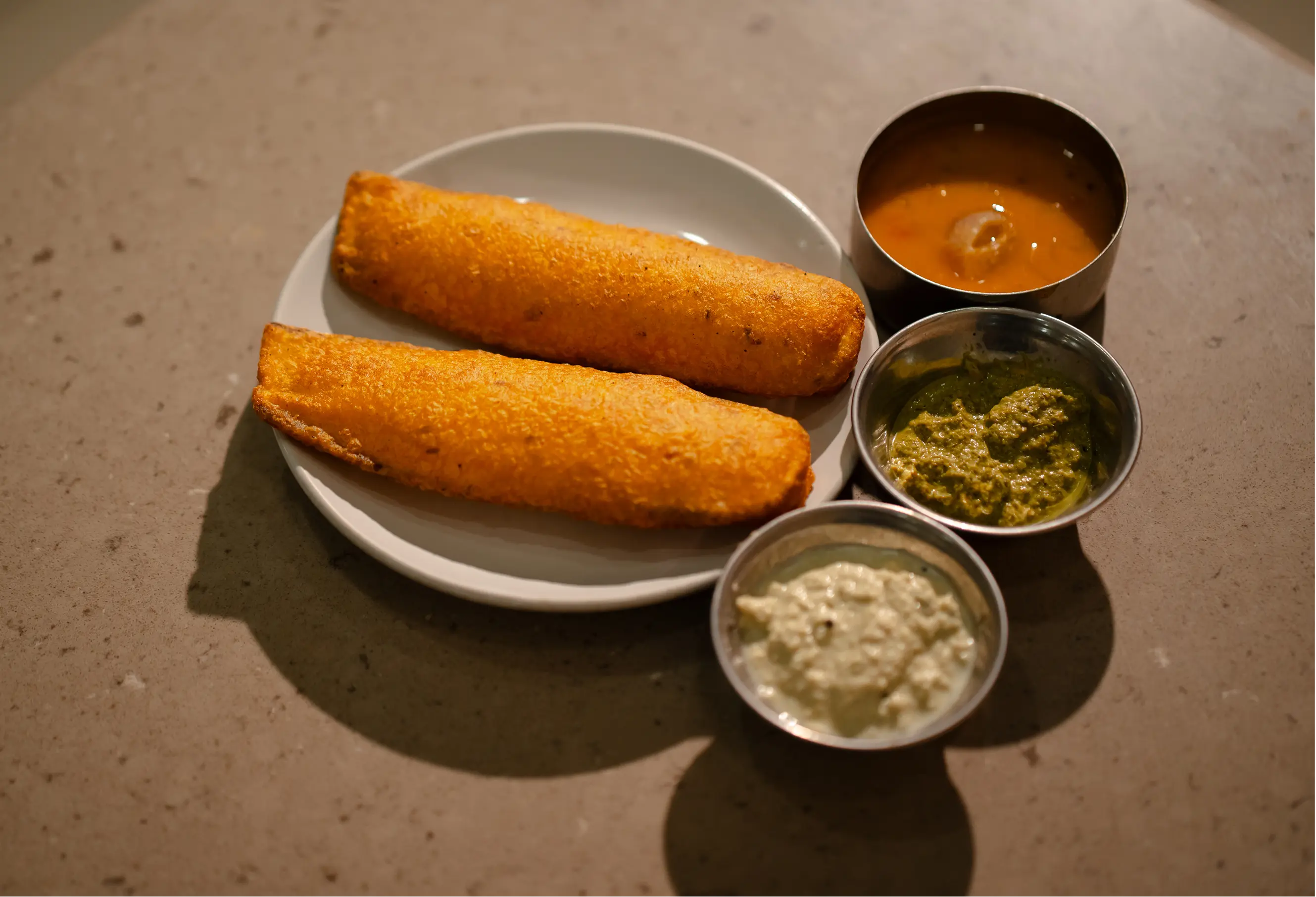 Crisp dosas with sambar and chutneys at Anandam