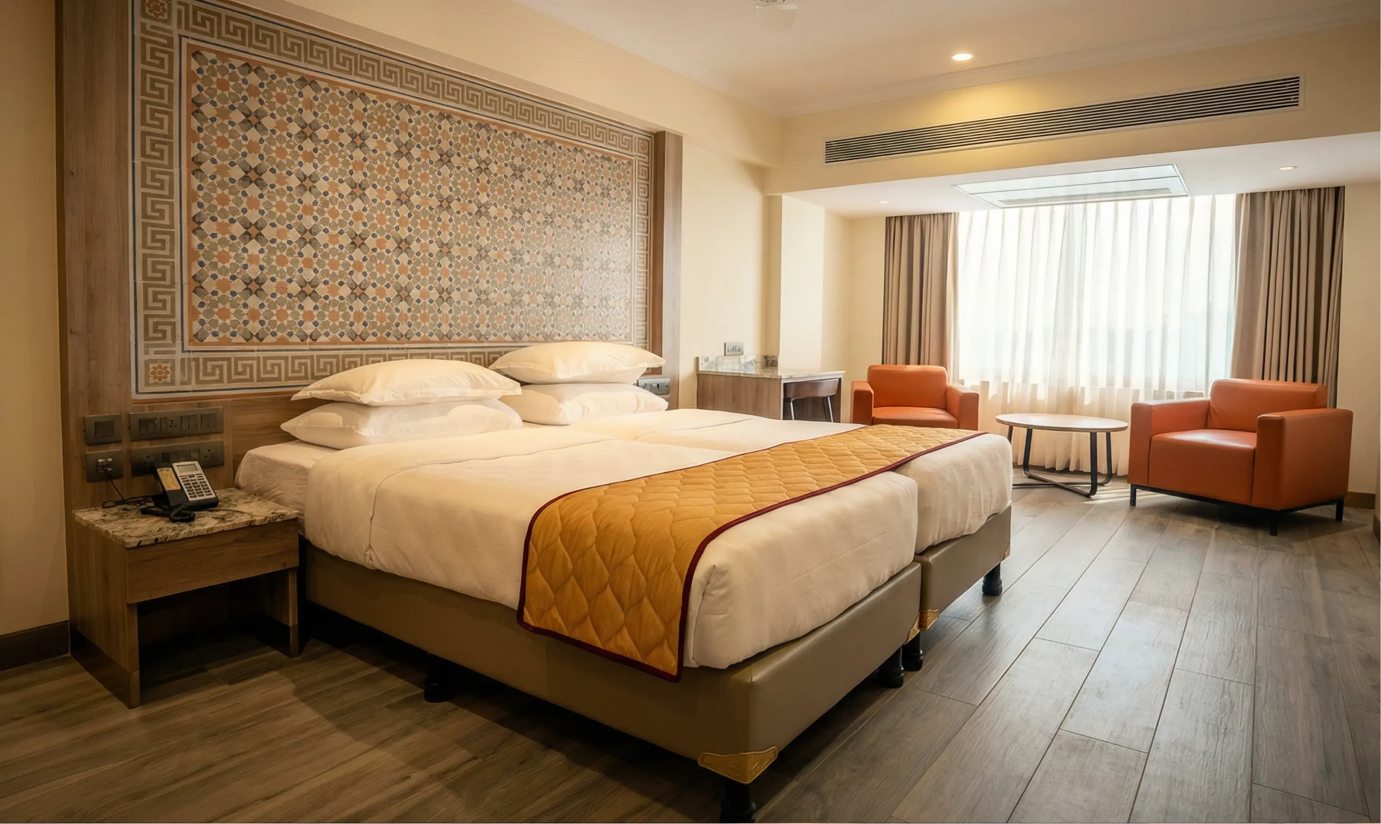 Executive room with twin beds and seating